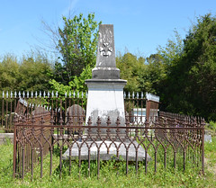 Grave surrounded by iron fence