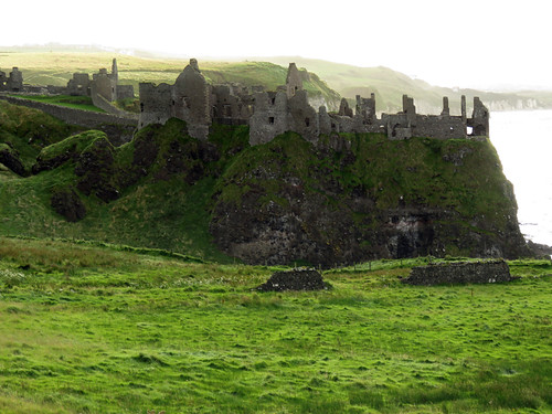 Dunluce Castle ruins in Northern Ireland, UK showing the hexagonal stones quarried from the Giant's Causeway in the evening light