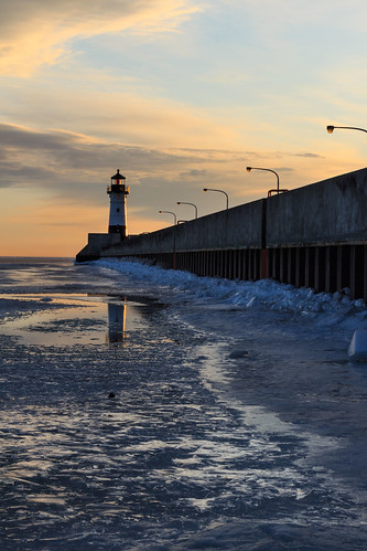 winter lighthouse reflection minnesota clouds sunrise duluth