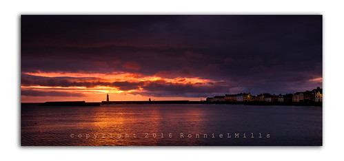 sunrise dawn rising sun early morning seascape donaghadee harbor harbour lighthouse red orange yellow purple sky clouds