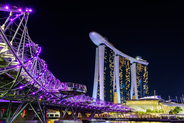 Helix Bridge and Marina Bay Sand Hotel at night time landmark in Singapore.