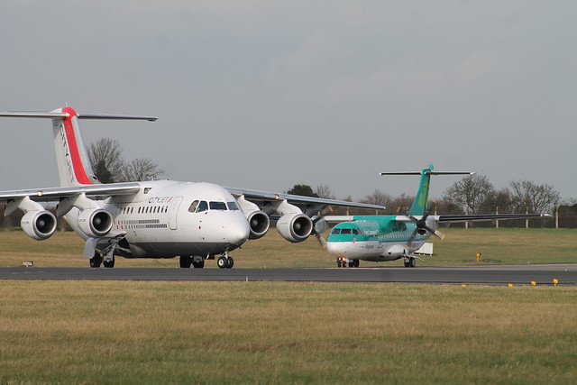 A Cityjet Avro RJ85 lines up on runway 10 ahead of a Stobart Air ATR-42-300.