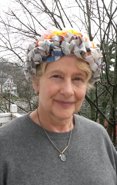 Jill in second compostable hat made from crocheted newspaper and repurposed crepe paper.