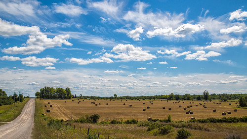 clouds michigan rural bucolic farm hayrolls millersburg unitedstates us