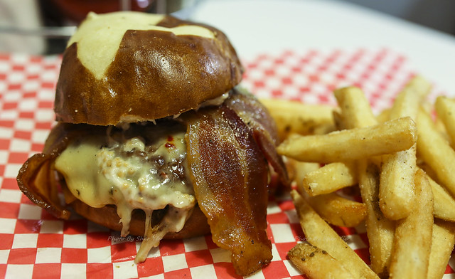 Wild Boar Burger - 1/3lb Wild Boar Patty, Marinated & Grilled Artichokes, Smoked Wildfire Jack Cheese, Bacon, Hazelnut Ale Mustard Aioli on a scratch made Pretzel Roll - Tailpipes