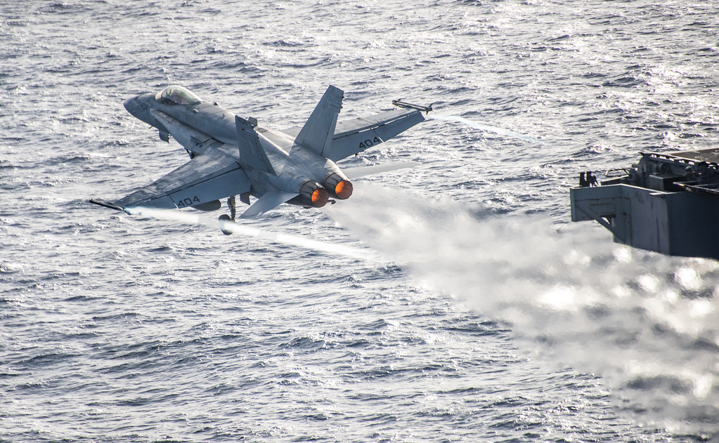 An F/A-18C Hornet launches from USS Carl Vinson (CVN 70).