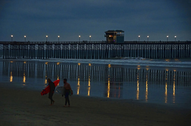 Night surfing at the pier in Oceanside California