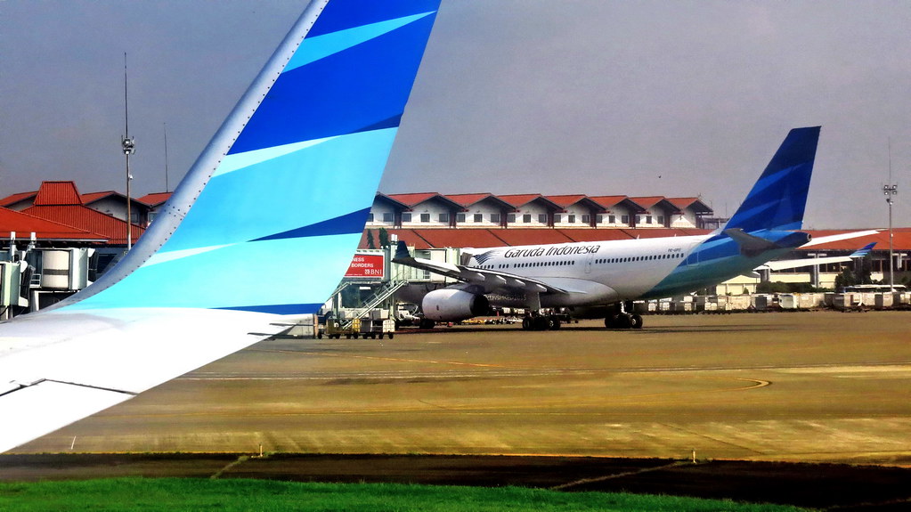 The blue wing and tail of Garuda Indonesia..