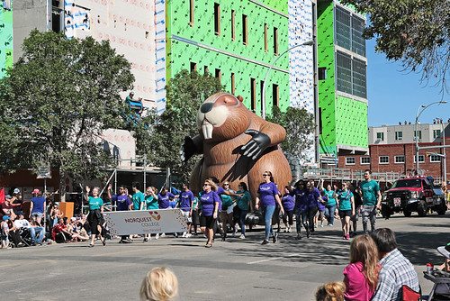 NorQuest parade walkers and Beaver balloon