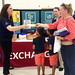 FORT GORDON, Ga. -- Associate Natasa Stroud, left, hands out information about the Exchange's You Made the Grade program and the upcoming tax-free weekend discounts to a mother during a back-to-school bash. Main Store Manager Page Clark looks on. 

By Christine Karimkhani