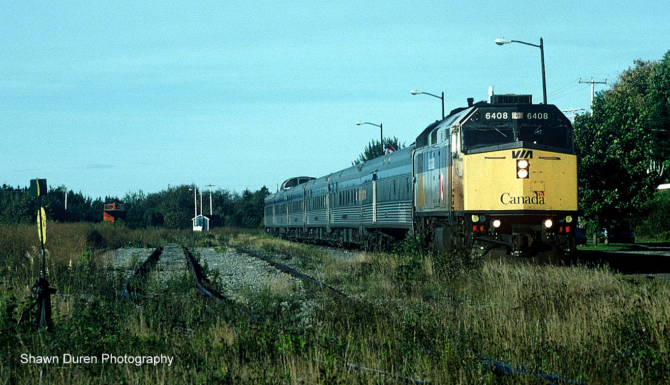 VIA Rail Train #16, the Chaleur arrives at the empty yard at New Carlisle, Quebec on October 4, 2003. This is where the Cascapedia meets the Chandler Subdivision.