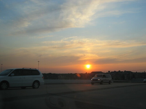 Road Sunset by TrafficChess, As we cross the bridge the sun sets in the distance.sunset clouds texas mesquite
