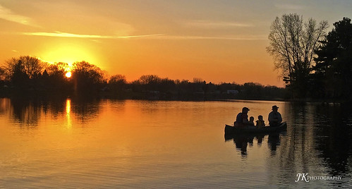 fishing canoe family sunset stanton michigan