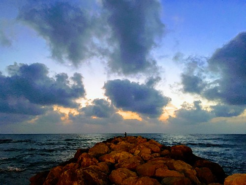 miro sunset sky sea clouds man alone quiet waves haifa israel blue rocks