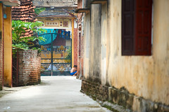 Young boy playing in an alleyway