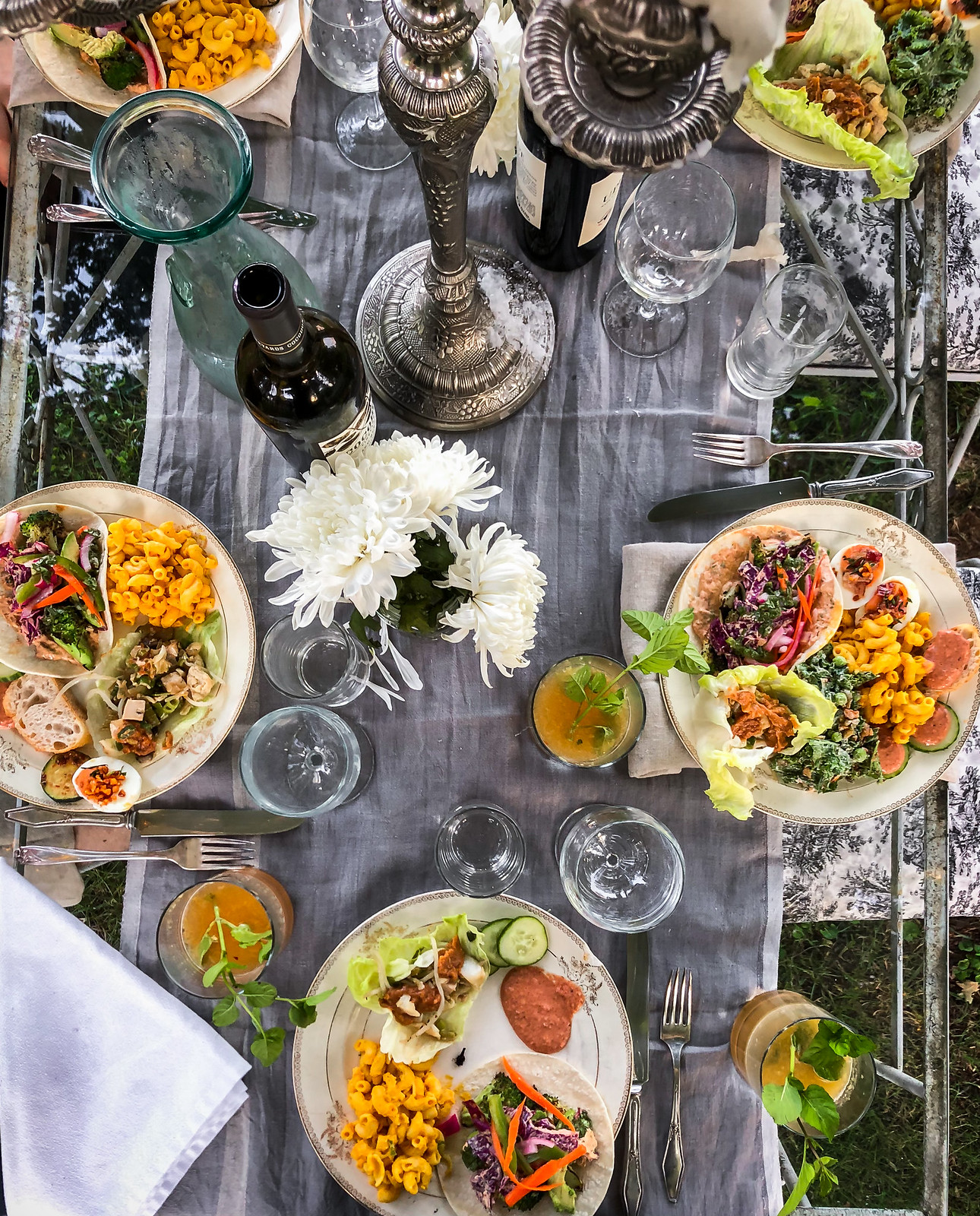 an elegant table, filled with good friends and delicious food