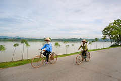 Riding bicycles along the river
