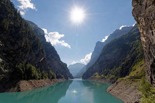 waterreservoir stausee switzerland alps mountains water sky sun hiking