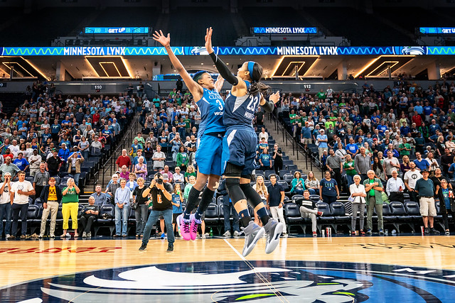 Danielle Robinson & Maya Moore celebrate the win against the Seattle Storm with a center court chest bump at at Target Center, Minneapolis. The Minnesota Lynx won 91-79