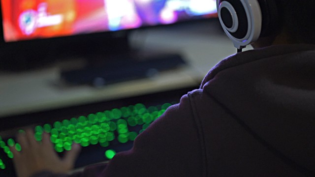 Over Shoulder shots of a Gamer Gaming with Headset video -… | Flickr