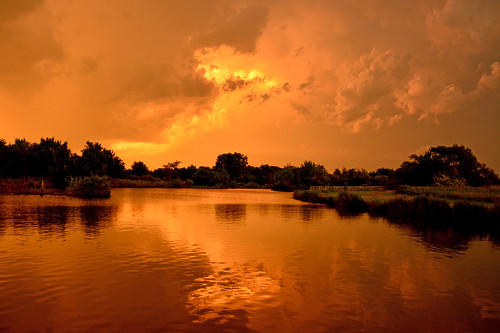 orange sunset reflections thunderstorm chisholmcreekpark wichita kansas