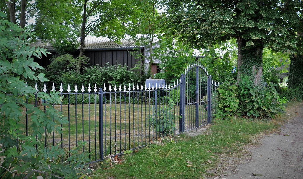 Someone's Back Garden Wrought Iron Railing Fence
