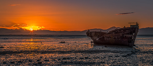 boat sun rust newzealand landscape red shipwreck nz water sunrise sky sunlight panorama sea motueka clouds