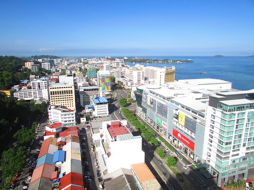 buildings downtown town cbd district grid highrises view morning sunny tropical destinations capital shops roof kotakinabalu jesselton mercure sabah malaysia borneo thienzieyung cars road streets above