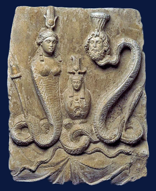 Isis and Osiris (Serapis) with body of a serpent, between them a Canopus